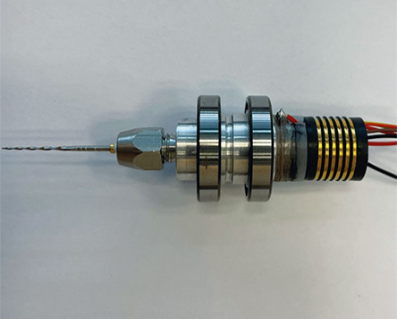 Piezo stack actuator in contra-angle handpiece.